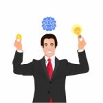 Businessman Under Brain And A Light Bulb Stock Photo