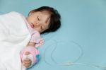 Baby Have Diarrhea And Sleep On A Bed In Hospital With Saline In Stock Photo