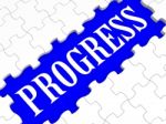 Progress Puzzle Shows Business Growth Stock Photo