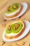 Toast With Kiwi, Cheese And Walnuts Stock Photo