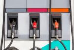 Three Refuel Nozzles In Gas Station Stock Photo