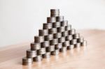 Pyramid Of The Coins On The Table Stock Photo