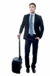 Young Business Man Holding A Trolley Bag Stock Photo