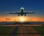 Jet Plane Taking Off From Airport Runway For Traveling And Logistic Theme Stock Photo