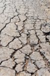 Old Worn And Cracked Asphalt With Cracks Stock Photo