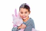 Happy Little Girl Holding Pink Unicorn Toy Isolated On White Stock Photo