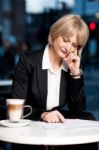 Thoughtful Business Woman In Cafe Stock Photo