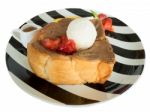 Ice Cream, Strawberry, Orange And Bread, On Black And White Plate.  Stock Photo