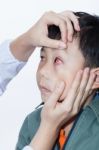 Pinkeye (conjunctivitis) Infection On A Boy, Doctor Check Up Eye Stock Photo