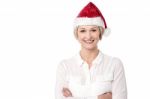 Arms Crossed Cheerful Lady Wearing Santa Cap Stock Photo