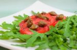 Salad With Fresh Tomatoes, Capers And Arugula Stock Photo