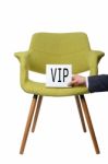 Businessman Hold White Paper Note "vip" On Modern Green Armchair Stock Photo