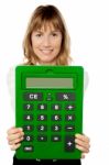 Lady Showing Big Green Calculator Stock Photo