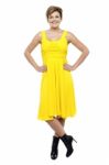 Attractive Blonde Wearing Bright Yellow Frock Stock Photo