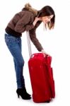 Young Woman Searching Her Baggage Stock Photo