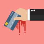 Businessman Bloody Hand Holding Credit Card Stock Photo