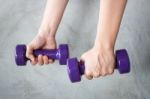 Woman Hand Holding Violet Dumbbell Stock Photo