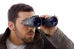 Male looking Through Binoculars Stock Photo