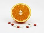 Healthy Orange With Vitamin And Mineral Tablets Stock Photo