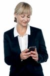 Entrepreneur Reading Message On Her Mobile Stock Photo