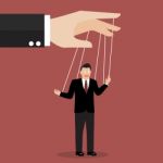 Businessman Puppet On Ropes Stock Photo