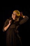 Beautiful, Fashionable, Glamorous, Nice, Attractive,pretty,nice,cheerful,smiling,parisian Girl,woman,student,teenager,lady With Cite Smile,face,well-dressed And Yellow Beret,cap,gesture,pose,posing.portrait.black Background.photo Studio.paris,manners Stock Photo