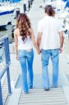Couple Walking And Holding Hands Stock Photo