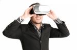 Isolated Young Businessman With Virtual Reality Glasses Stock Photo
