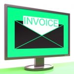 Invoice In Envelope On Monitor Shows Receipts Stock Photo