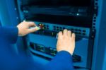 Man Fix Server Network In Data Center Room Stock Photo