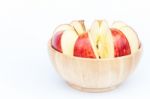Sliced Apple In Wooden Bowl Stock Photo