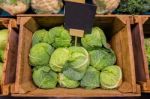 Fresh Cabbage Vegetable In Wooden Box Stall In Greengrocery With Blank Chalkboard Label Stock Photo