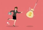 Business Woman Try To Pick Money Bag From Hook Trap Stock Photo