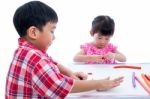 Asian Kids Playing With Play Clay On Table. Strengthen The Imagi Stock Photo