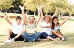 Young Family Having Fun In Park Stock Photo