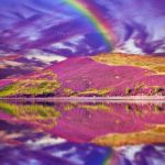 Colorful Landscape Scenery Of Rainbow Over Hill Slope Covered By Stock Photo