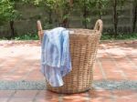 Clothes In A Laundry Wooden Basket Stock Photo