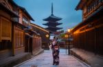 Asian Woman Wearing Japanese Traditional Kimono At Yasaka Pagoda And Sannen Zaka Street In Kyoto, Japan Stock Photo