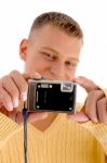 Young Man Holding Digital Camera Stock Photo