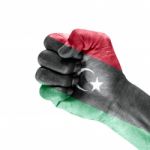 Libya Flag On Clenched Fist Hand Stock Photo