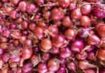 Heap Of Red Onions On Market Stock Photo