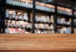 Top Wooden Table In Coffee Shop Blurred Background Stock Photo