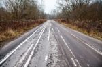 Old Abandoned Asphalt Road With Spoiled Road Markings Stock Photo