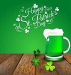 Green Beer With Shamrock On Wooden Floor For St. Patrick's Day Stock Photo