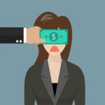 Business Woman With Dollar Banknote Taped To Eyes Stock Photo
