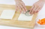 Bread Cut Into Circle Shape On White Plate With Women Hands Work Stock Photo