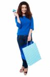 Shopaholic Woman Holding Shopping Bags And Credit Card Stock Photo
