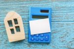 Calculator With House Model And Blank Card Stock Photo