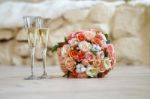 Bridal Bouquet And Two Glasses Of Champagne Stock Photo