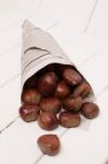 Sweet Chestnuts Wrapped In Newspaper Stock Photo